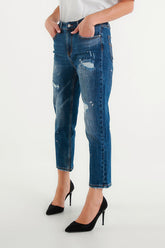 Jeans cropped blu con effetto used e dettagli paint